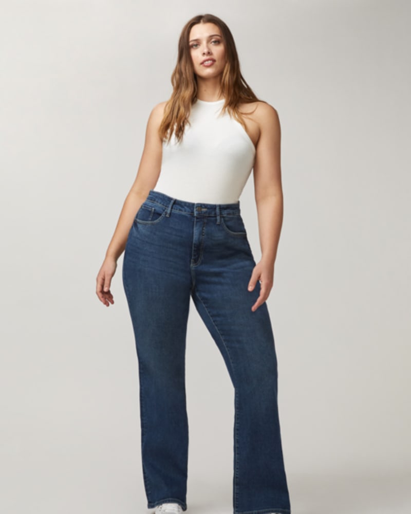 Front of a model wearing a size 14 Mia Flared Jeans in Summer Time by Warp + Weft. | dia_product_style_image_id:248993